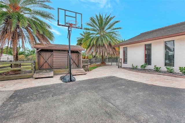 17500 SW 68th Ct, Southwest Ranches, FL 33331 - view of patio / terrace featuring fence, an outbuilding, and a storage shed