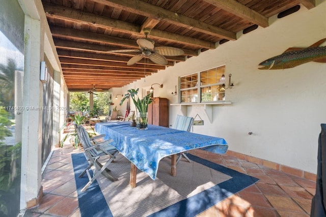 view of patio with outdoor dining space and a ceiling fan
