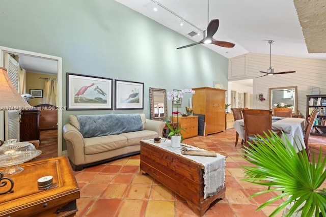 living area with visible vents, rail lighting, high vaulted ceiling, and ceiling fan