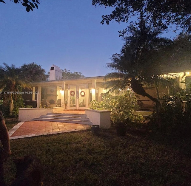 rear view of house featuring a patio area