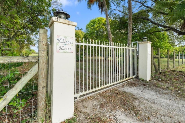 view of gate with fence