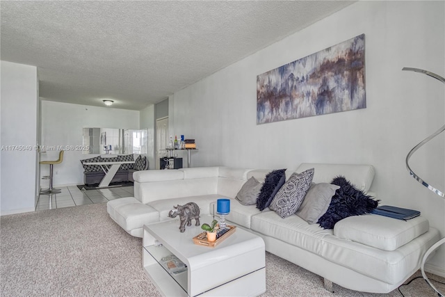 tiled living room with a textured ceiling