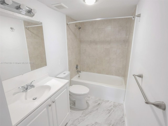 full bathroom with vanity, toilet, and tiled shower / bath