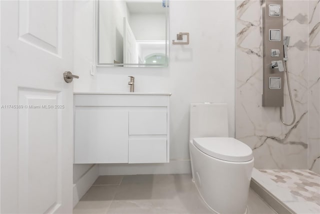 bathroom featuring vanity, a shower, and toilet