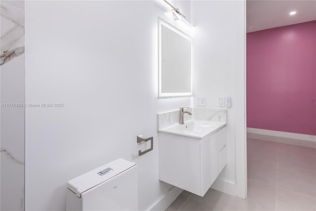 bathroom with tile patterned floors, vanity, and toilet