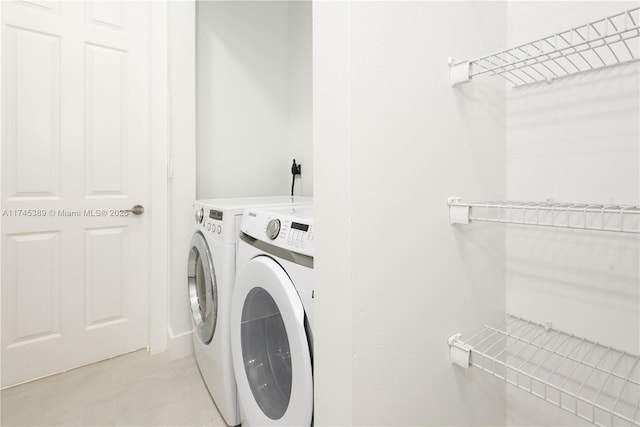 laundry area with separate washer and dryer