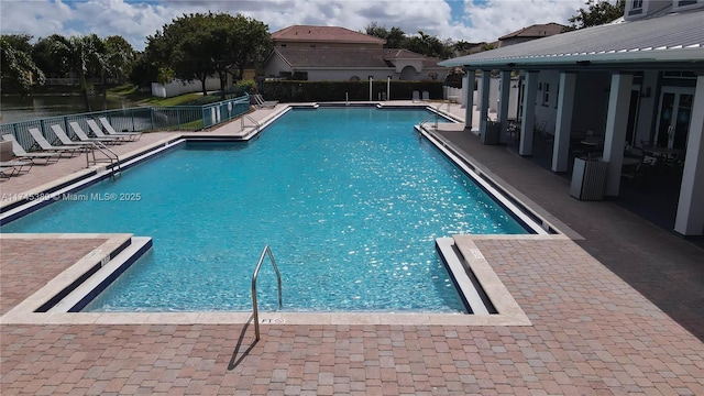 view of swimming pool with a patio