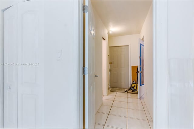 hallway with light tile patterned floors