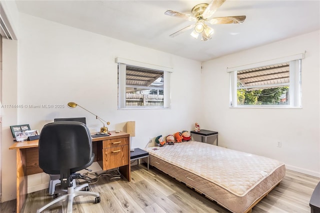 bedroom featuring ceiling fan and light hardwood / wood-style flooring