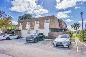 129 San Remo Blvd, North Lauderdale, FL 33068 - view of property featuring uncovered parking