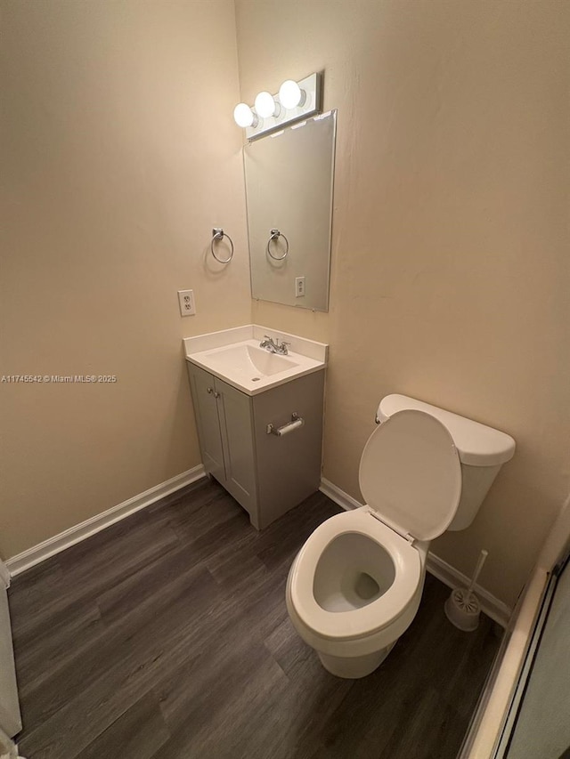 129 San Remo Blvd, North Lauderdale, FL 33068 - bathroom featuring vanity, toilet, baseboards, and wood finished floors