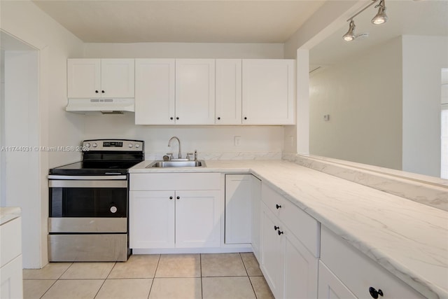 kitchen featuring sink, light tile patterned floors, white cabinets, and electric stove