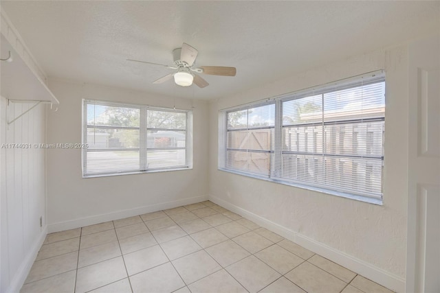 spare room featuring ceiling fan and a textured ceiling