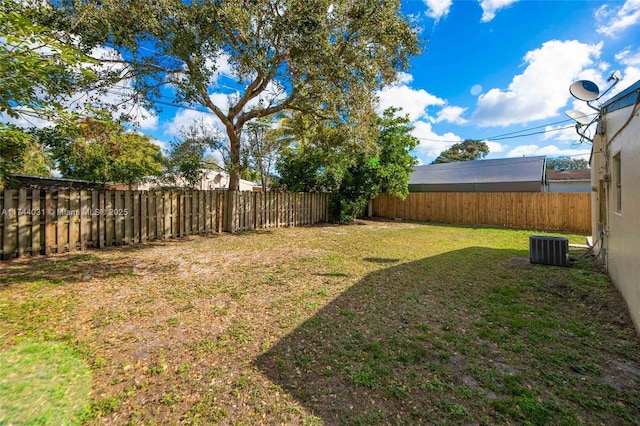 view of yard with central AC unit