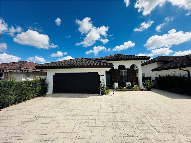 mediterranean / spanish house featuring a garage