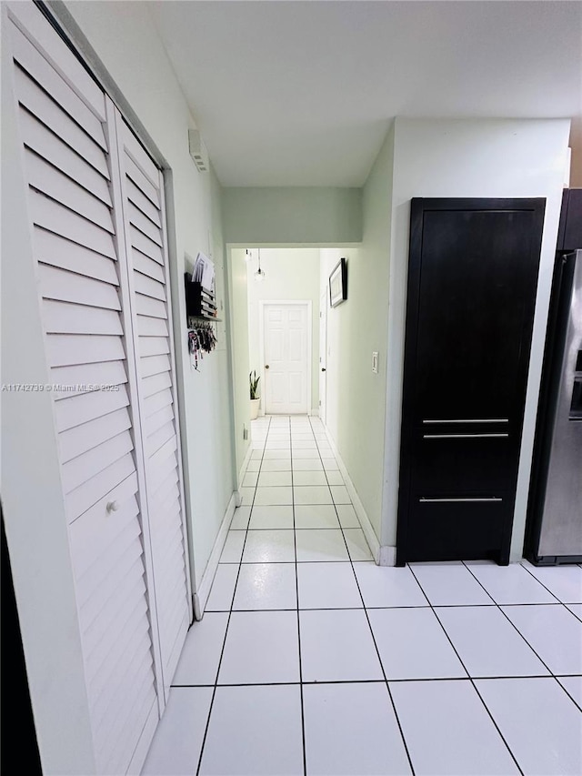 hallway with light tile patterned floors