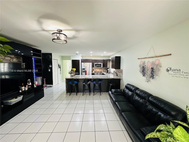 living room with light tile patterned flooring