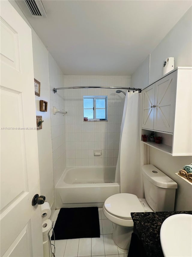 full bathroom with shower / bathtub combination with curtain, vanity, tile patterned flooring, and toilet