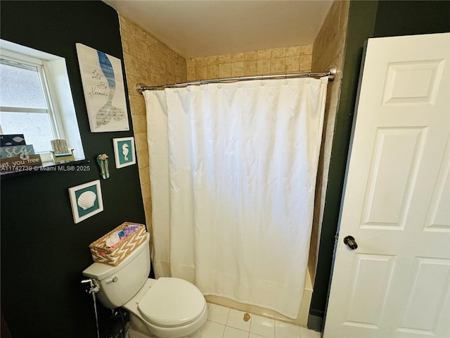 bathroom featuring tile patterned floors and toilet