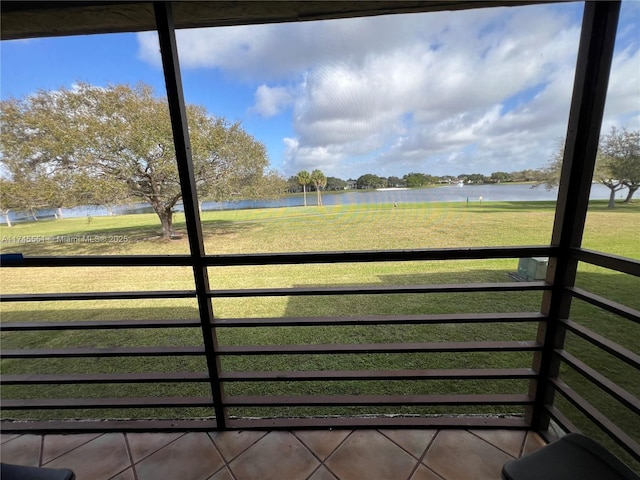 exterior space with a water view and a yard