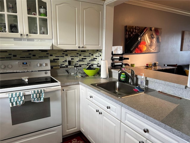 kitchen featuring crown molding, sink, electric range, and white cabinets