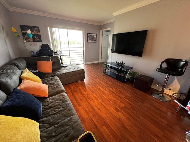 living room with hardwood / wood-style flooring and crown molding