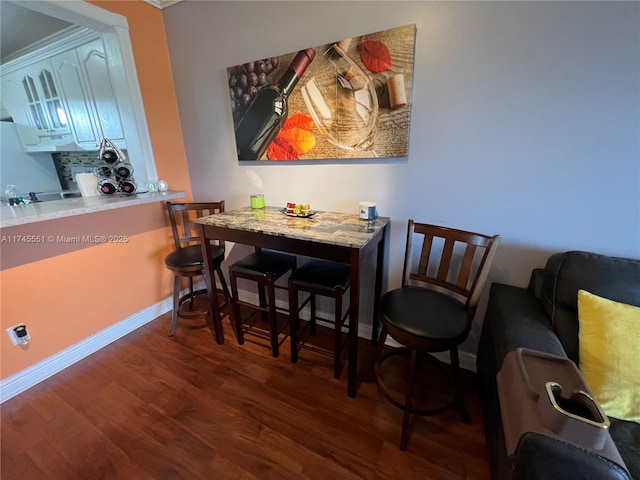 dining room featuring dark hardwood / wood-style flooring