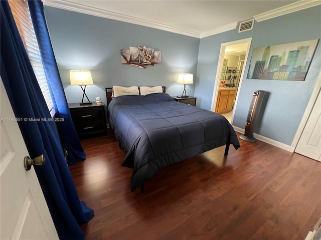 bedroom featuring dark hardwood / wood-style flooring, ensuite bath, and ornamental molding