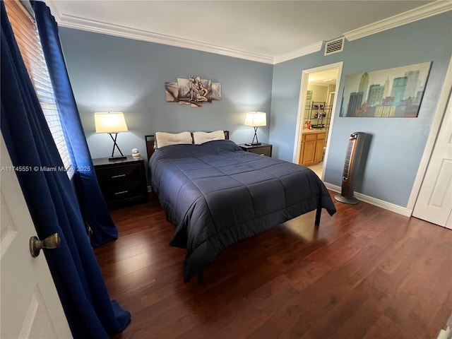 bedroom with crown molding, connected bathroom, and dark hardwood / wood-style flooring