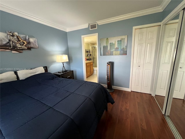 bedroom with crown molding, ensuite bathroom, and dark hardwood / wood-style flooring