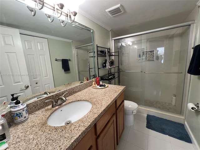 bathroom featuring a shower with shower door, tile patterned flooring, vanity, ornamental molding, and toilet