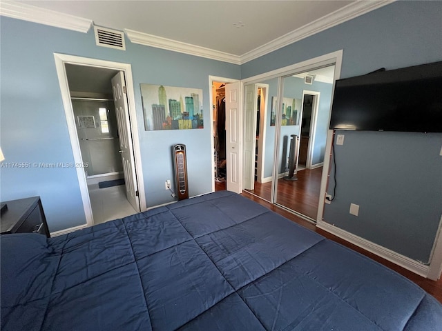 unfurnished bedroom with ornamental molding, dark hardwood / wood-style floors, and a closet