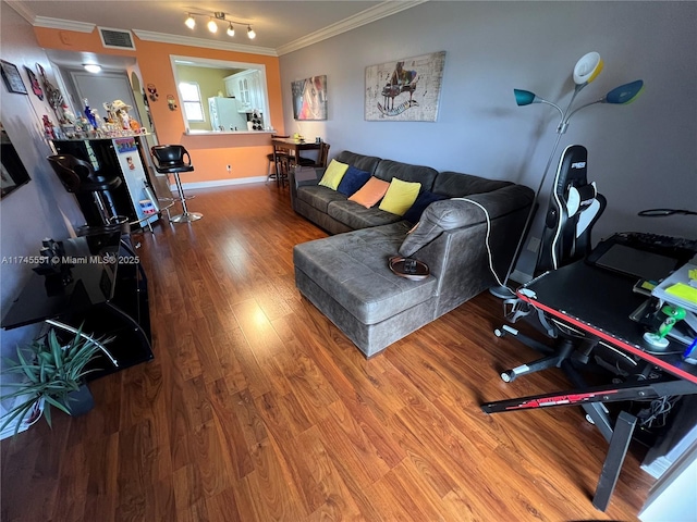 living room featuring crown molding and wood-type flooring