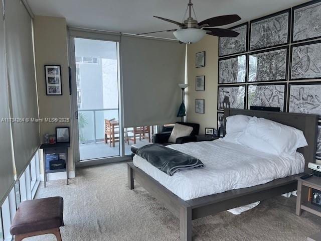 bedroom with carpet flooring and expansive windows