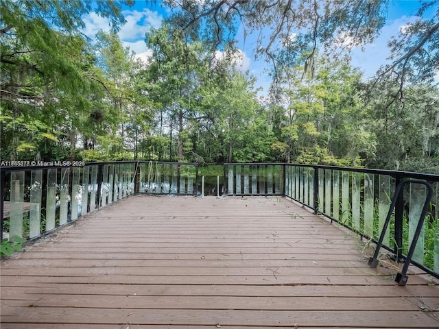 wooden deck featuring a water view