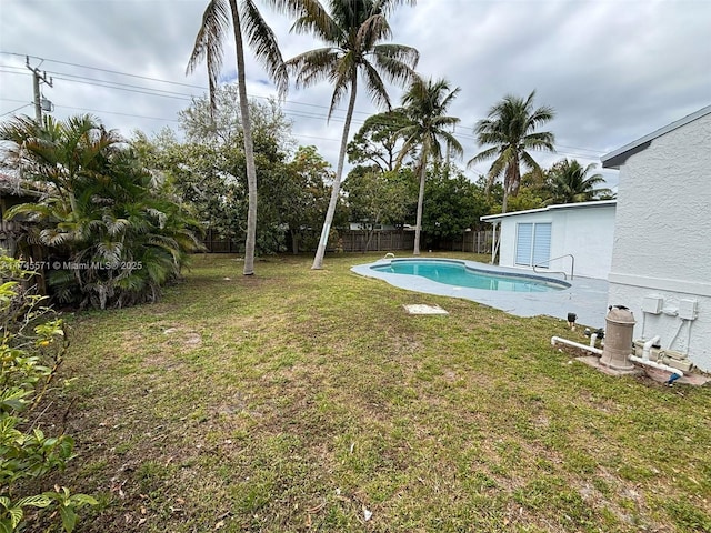 view of yard with a fenced in pool and a fenced backyard