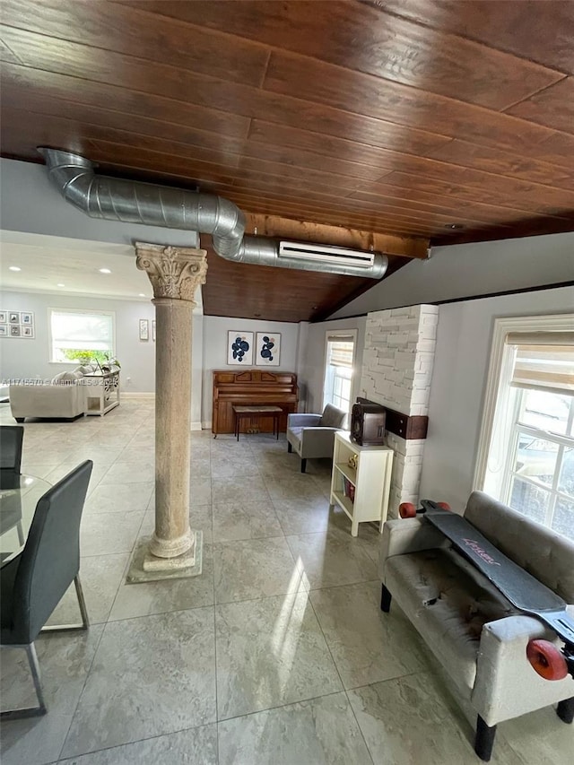 1787 NE 174th St, North Miami Beach, FL 33162 - living room with wooden ceiling, decorative columns, a wealth of natural light, and vaulted ceiling