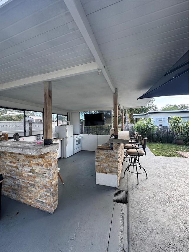 1787 NE 174th St, North Miami Beach, FL 33162 - view of patio / terrace with an outdoor kitchen, outdoor wet bar, and fence