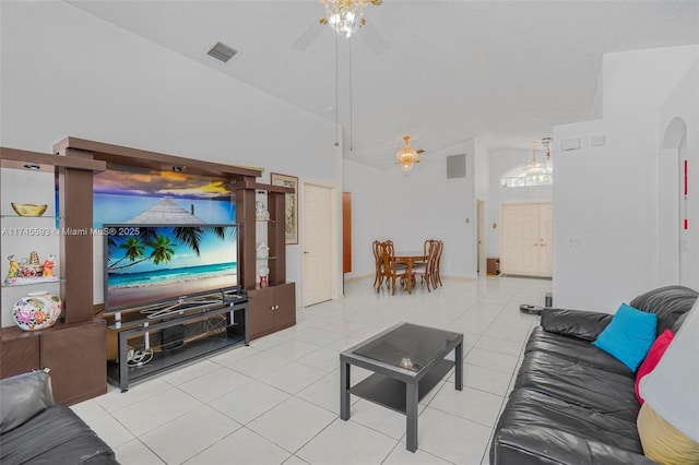 living room featuring ceiling fan, light tile patterned floors, and high vaulted ceiling