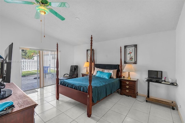 tiled bedroom with lofted ceiling, ceiling fan, access to outside, and a textured ceiling