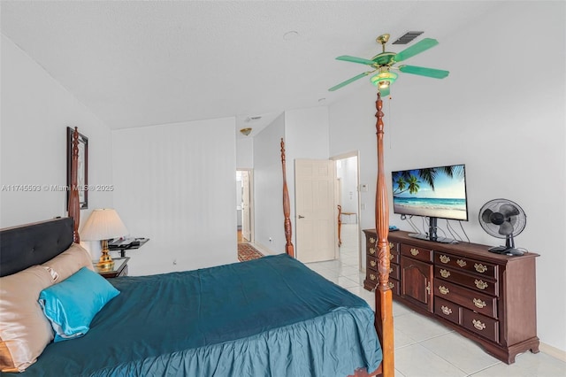 bedroom with light tile patterned flooring, lofted ceiling, and ceiling fan