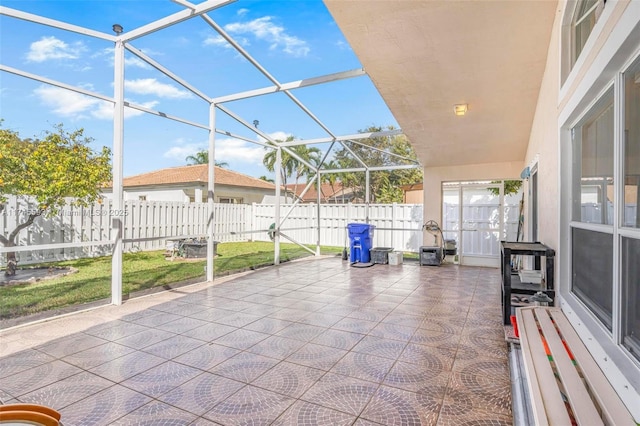 view of patio / terrace featuring glass enclosure