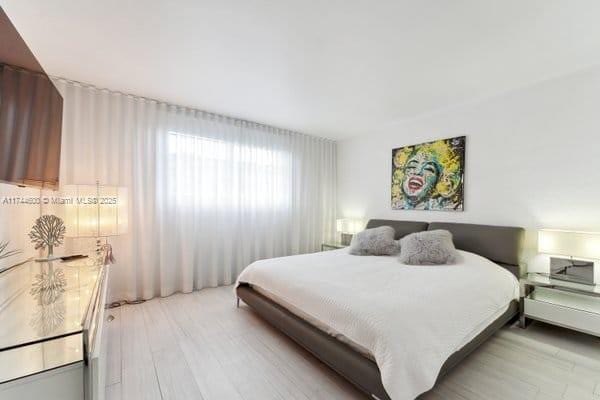 bedroom with light hardwood / wood-style floors