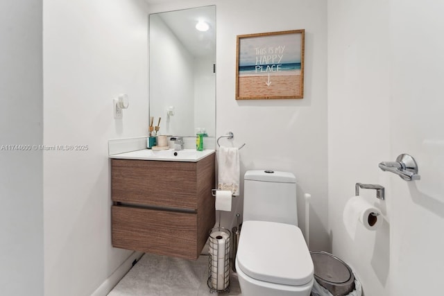 bathroom featuring vanity and toilet