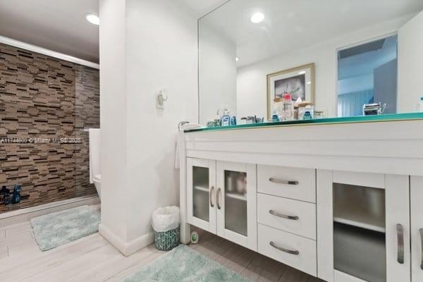 bathroom with vanity and walk in shower