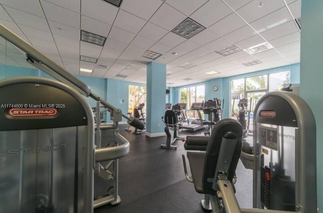 workout area with a drop ceiling