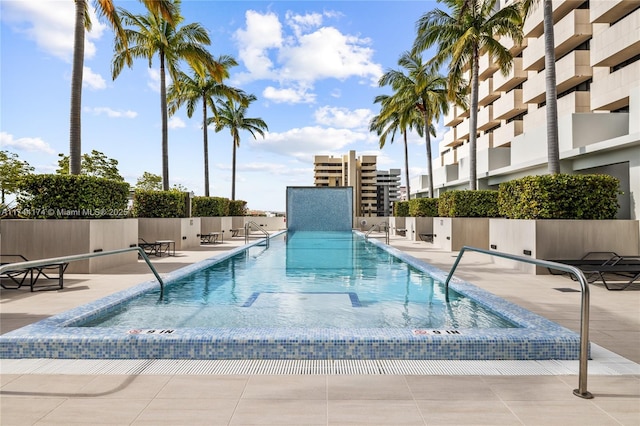 view of pool featuring a patio