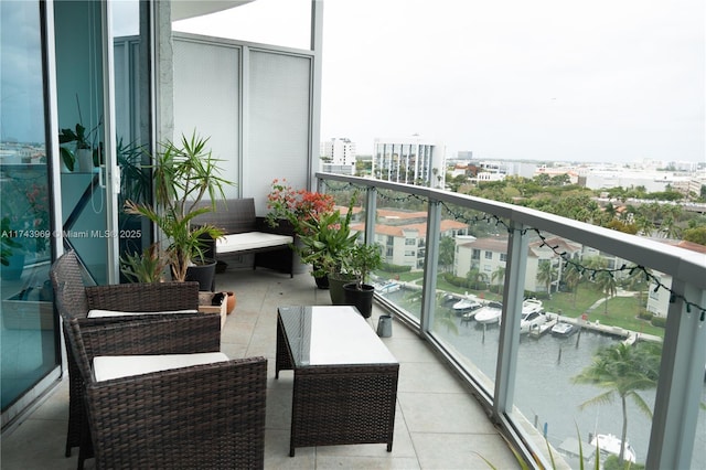 balcony with a water view and a city view