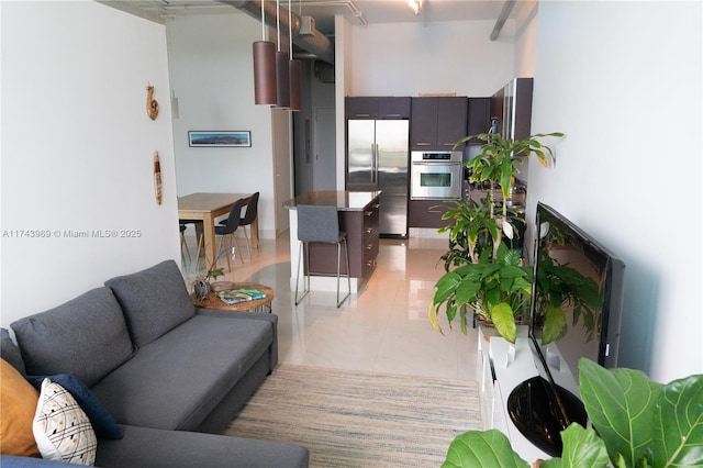 living area featuring light tile patterned flooring