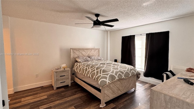 bedroom with dark hardwood / wood-style flooring, ceiling fan, and a textured ceiling